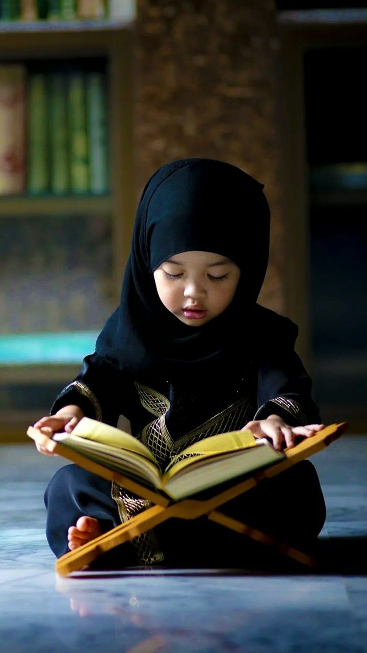 A girl reading the Quran